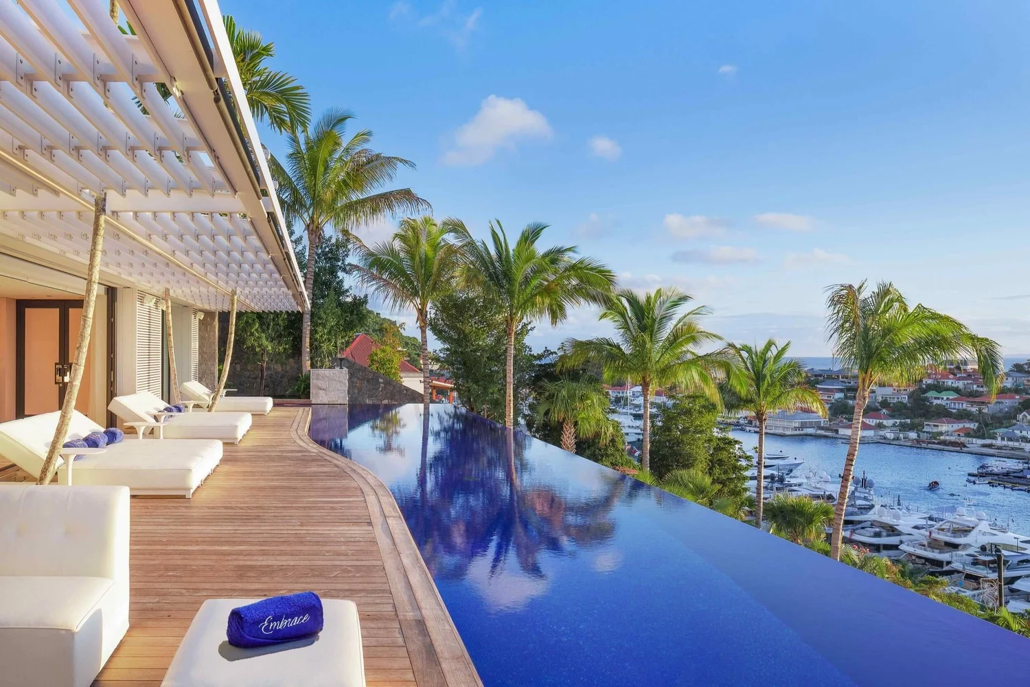 Luxury infinity pool overlooking peaceful port